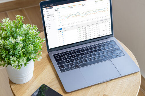 Image of laptop showing Amazon Advertising dashboard for reporting