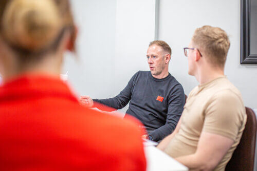 Image of team discussing terms to be negotiated for a vendor client