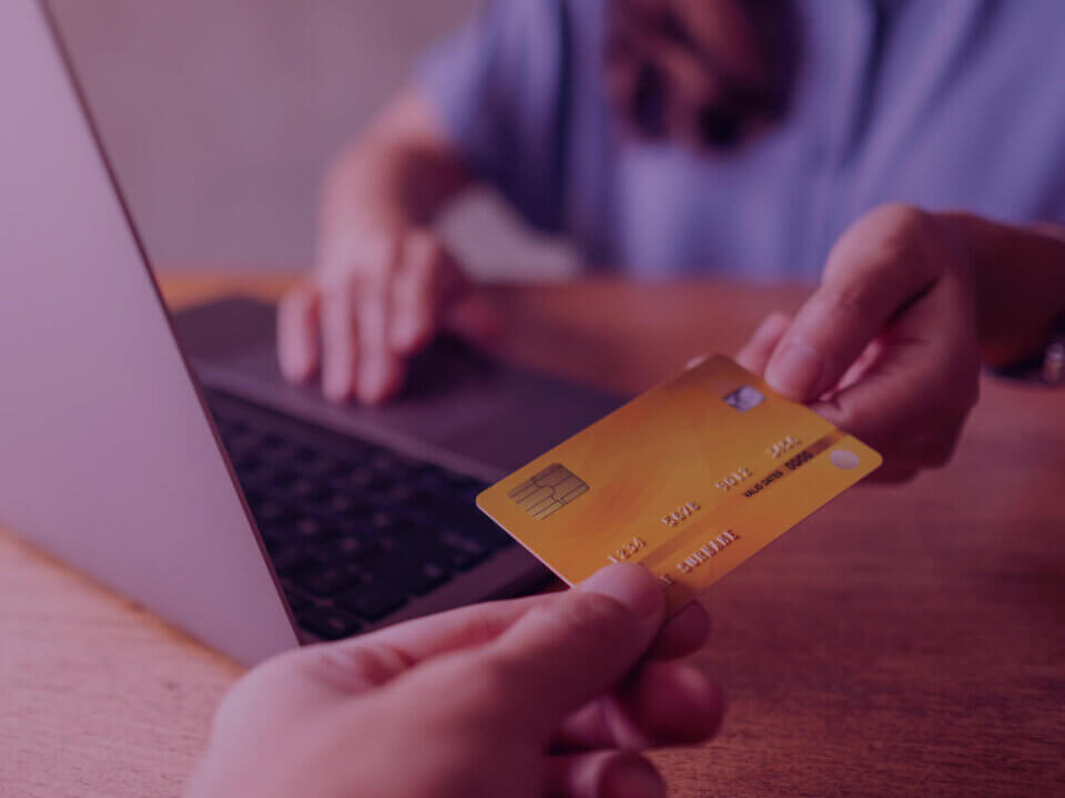 A person using a credit card for shopping online.