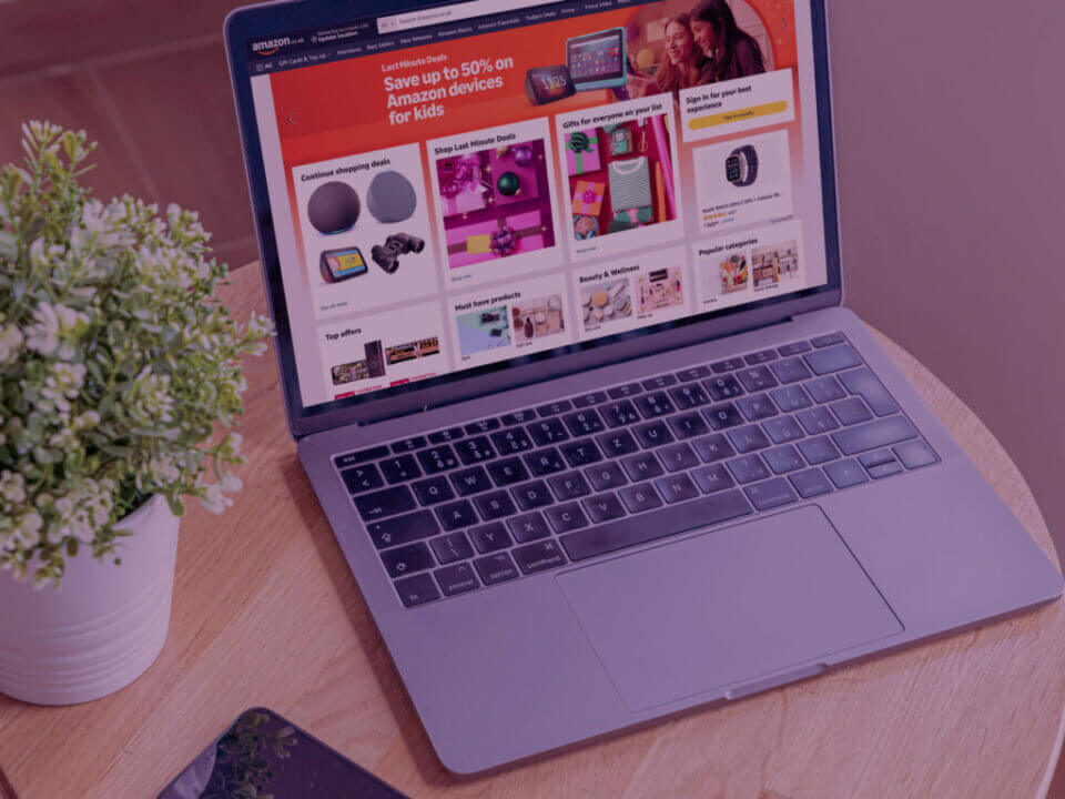 Laptop with Amazon displayed on screen.