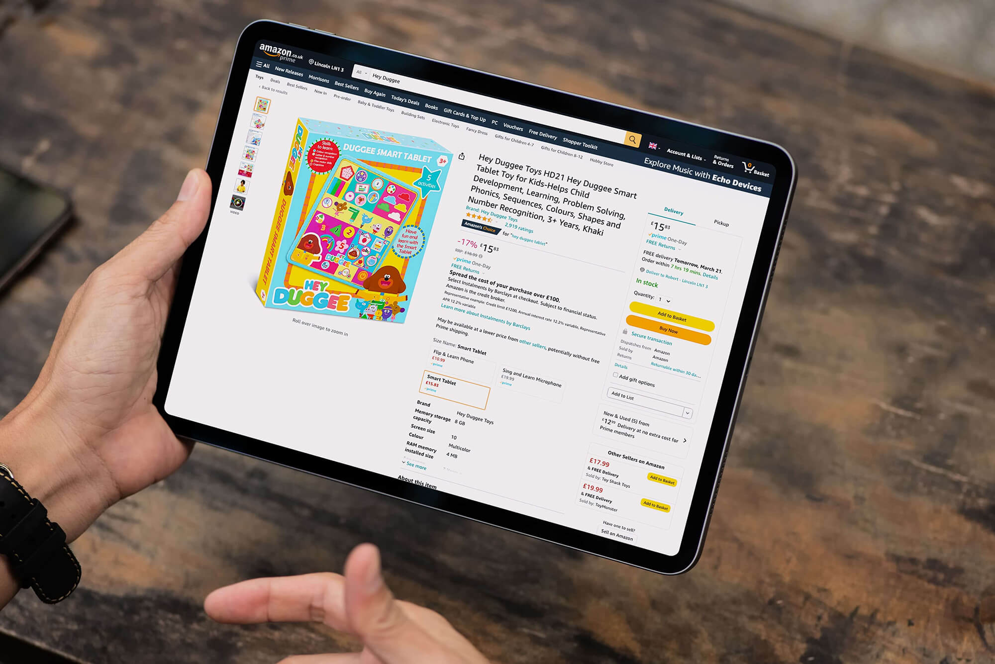 Person viewing an Amazon product page on a tablet, representing Venture Forge’s SKU Strategy service for optimising product selection and profitability.