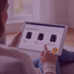 Team member reviewing product listings and performance data on a tablet in a modern office setting.